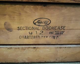 Antique Macey 3-section oak barrister bookcase with original metal wheels