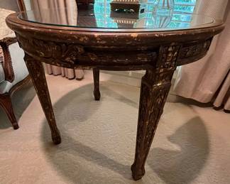 This cane-top table is very elegant, but would fit in with any style.