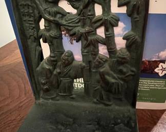 Cast iron bookends.  There are two (2) sets of these.  Located in different areas of the home.