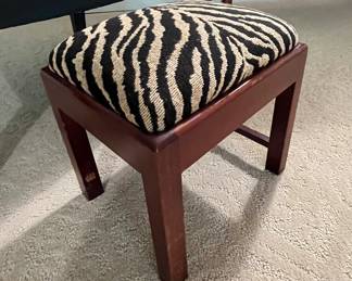 This cutie stool is just the perfect height to get your feet off of the ground and elevated just enough to relax.  It will slide under most chairs if you wanted it out of site.