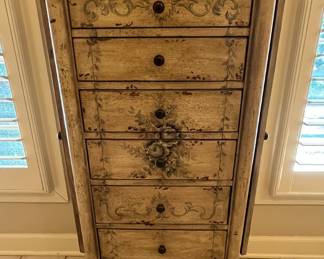 Jewelry cabinet.  Not only is it useful, it is a gorgeous accent piece for your bedroom, closet, or your bathroom as in the picture above.