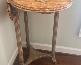 This little corner table has three sides that fold out into a "clover" shaped table.  It could have many purposes.  I believe they had an orchid growing out of the middle triangular piece, as it is lined with waterproofing.  But it could be used in a multitude of ways.