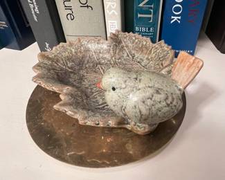 Dainty piece of pottery.  A place to lay your change or your rings.