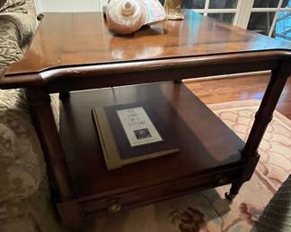 Century brand end table with one slender drawer at bottom.