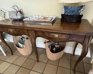 This is a 1990's Milling Road Flip Top Console Table.  Slide it apart, and fold the top piece over, and you have a full-sized dining table.  