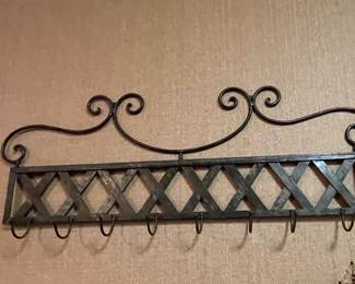 This coat rack, or pot rack, or scarf rack, or whatever you deem it to be, is larger than it appears.  It is approximately 4' to 4.5' long.