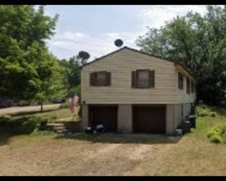 Side of house & driveway. 
