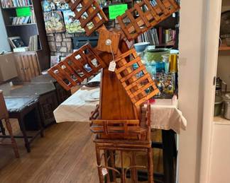 Large wooden windmill with rattan & bamboos stand.