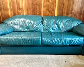 Green leather sofa and love seat