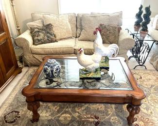 This pretty coffee table is inlaid with metal scrollwork. Rooster and hen by Bordallo Pinheiro.