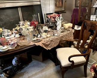 Dining room table and 6 queen anne chairs - displaying various collectibles