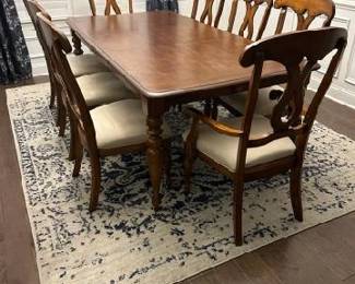 One of three sets of dining room tables and chairs. Seats 8 and has leaf. In great condition.