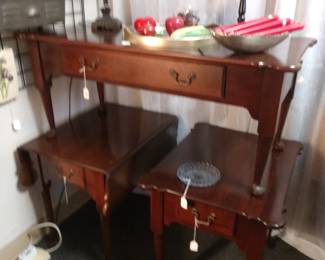 Like new coffee table and two end tables. One is a drop leaf.