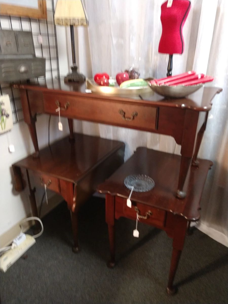 Like new coffee table and two end tables. One is a drop leaf.