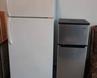 Refrigerator with freezer and small dorm size fridge with small freezer as well