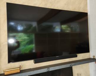 Samsung flat screen TV, with wall mount. Older model but works perfectly, shown streaming Netflix. Samsung soundboard with subwoofee