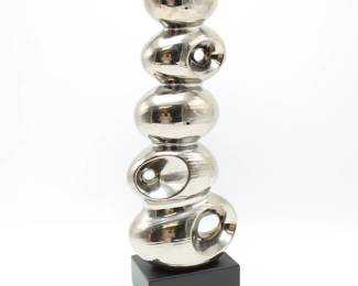 Tall Silver Tone Abstract Metal Sculpture on Black Stand
