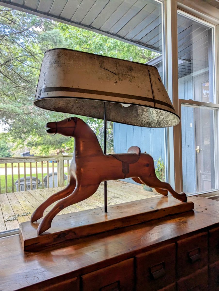 Hand carved horse converted to a lamp with antique baby tub shade.