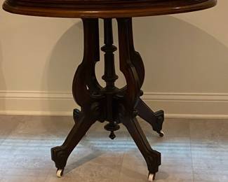 Nice oval marble top parlor table with porcelain castors