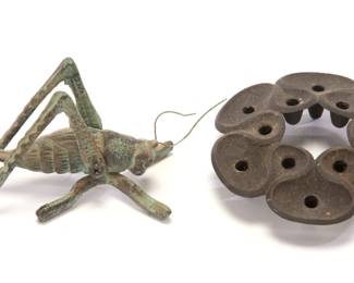 metal grasshopper and candlestick