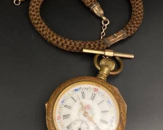 Antique pocket watch with antique hair watch chain