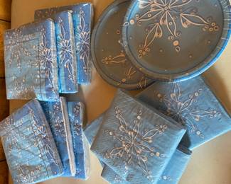 Lots of unused holiday napkins and plates available.