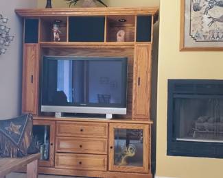 Oak 2 piece TV Amoire. Glass doors, 3 drawers, lights, CD and DVD holder.