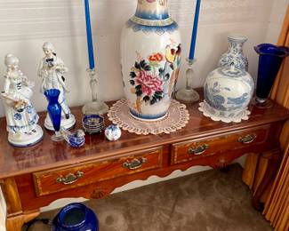 Queen Anne sofa table, blue and white ginger jar, cobalt art glass vases, pair of blue and white Victorian couple