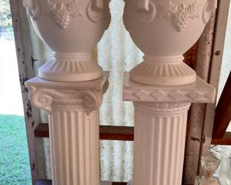 pair of heavy plastic planters and stands