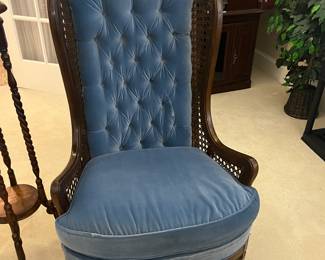 blue chair with tufted back and cane sides