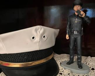 police figurine and hat