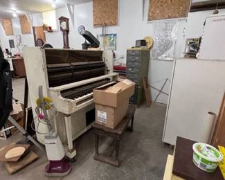Player piano with bench and about 40 songs.  Definitely needs some TLC, but what a great project gif the winter.  