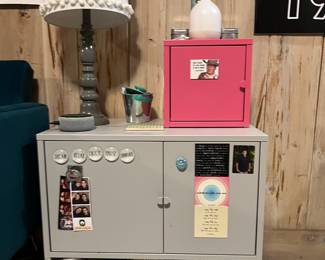 IKEA metal storage - grey, doors open. Also pink metal storage cube that’s on top. $20 for both