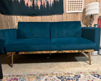 Small couch that converts to futon. Turquoise and gold accents. Had less than one year - like new. $120