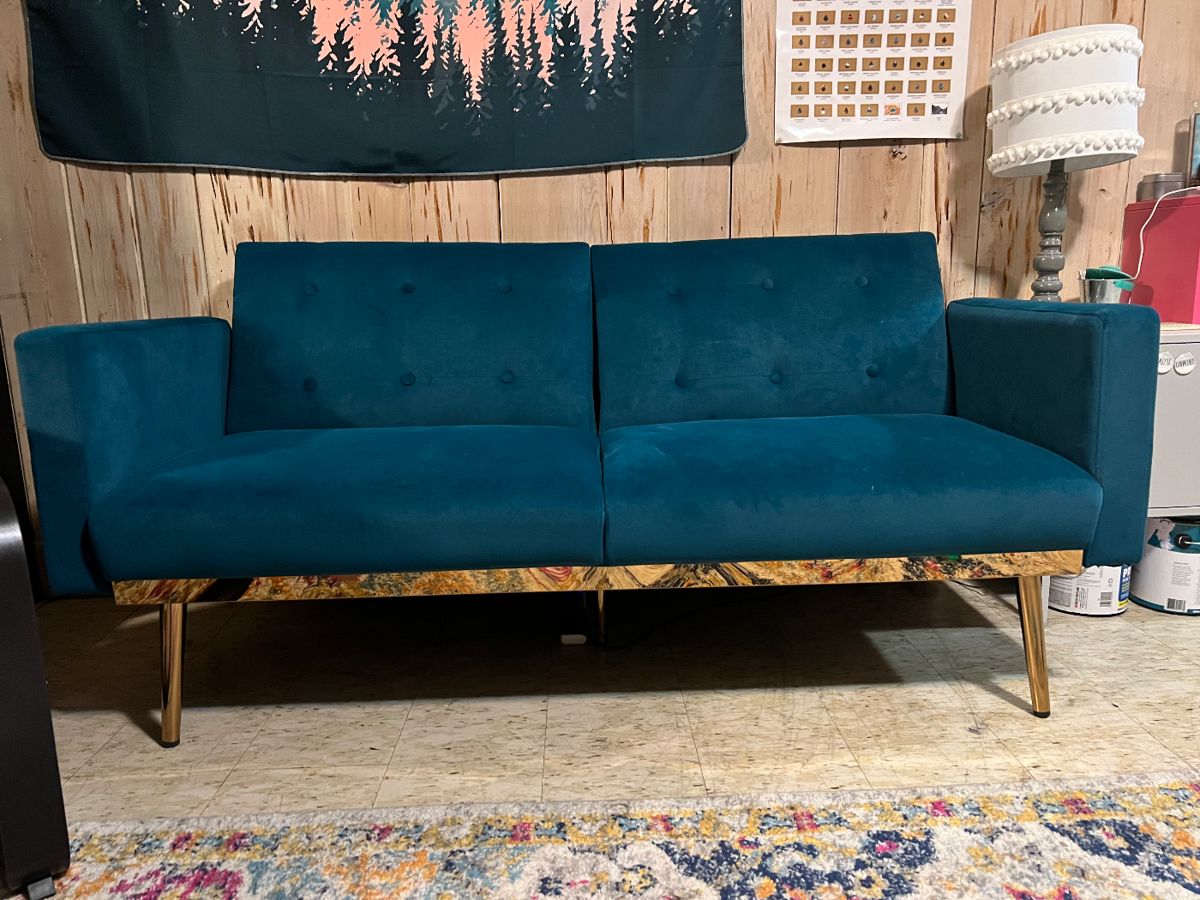 Small couch that converts to futon. Turquoise and gold accents. Had less than one year - like new. $120
