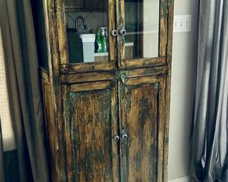 This cabinet looks 100% better in person.  The crystal cut bowls on top are beautiful. 