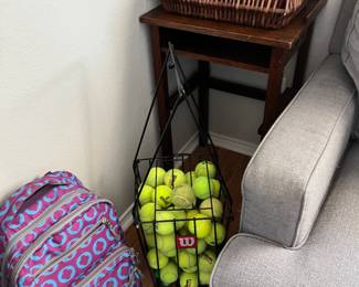 Tennis balls and retriever basket.  