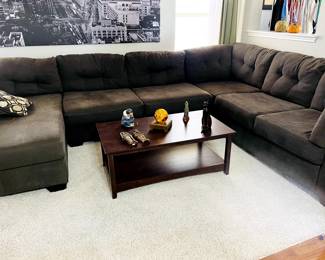 Very large sectional.  Dark gray in great shape.  3 pieces. Coffee table.  