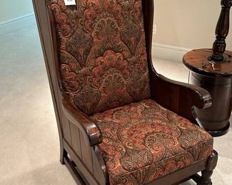 We have two of these chairs with matching ottoman that doubles as a tray/table