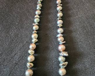 Tahitian Round Pearls separated by baroque (irregular shaped) Tahitian pearls. 