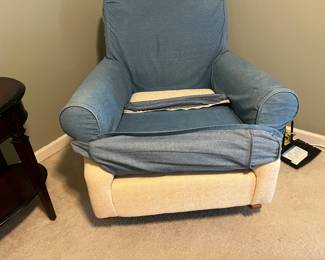 Rocking/swivel chair 
Denim slipcover. 
Cream fabric under slipcover. 
