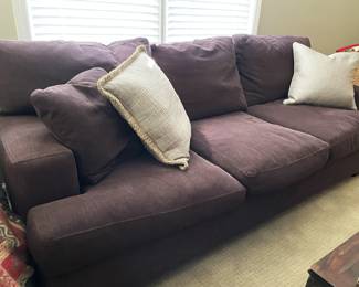 brown fabric couch  with throw pillows