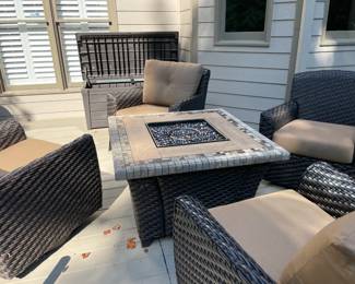 outdoor furniture, gas fire pit, outdoor storage container, tan cushions