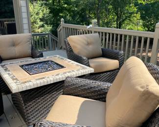 outdoor furniture, gas fire pit, outdoor storage container, tan cushions