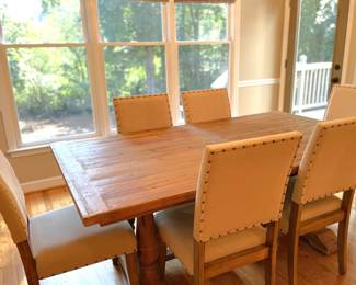 wood dining table with yellow dining chairs