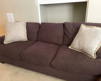 brown fabric couch, throw pillows