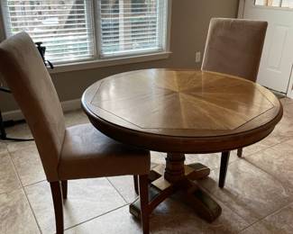 small circular dining table and chairs