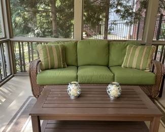 swivel rocking outdoor glider, wood coffee table, throw pillows