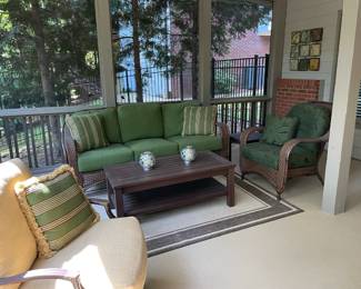 swivel rocking outdoor glider, wood coffee table, throw pillows