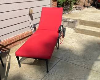red poolside lounger, iron side table